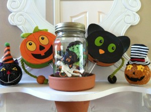 Cupcake toppers, rings, plastic skeltons...keep them for a fun display that will one day look vintage!